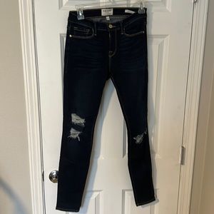 Frame dark denim skinny jeans with distressing; size 27